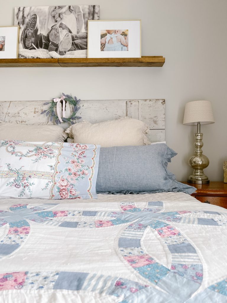 Layered farm cottage bed with vintage quilt and pillow case